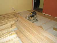 Chestnut wood at left, to be laid in the office within a border of bigleaf maple wood